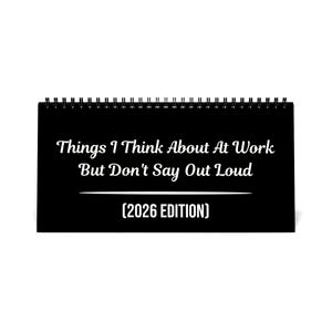 May include: A black desk calendar with a spiral binding. The cover features white text that reads "Things I Think About At Work But Don't Say Out Loud (2026 EDITION)".