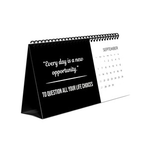 May include: A black and white desk calendar for September. The calendar features the text "Every day is a new opportunity. To question all your life choices." The calendar is spiral-bound at the top.
