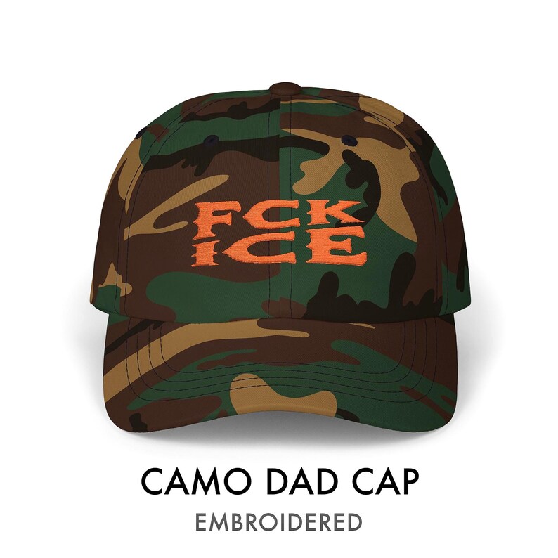 May include: A camouflage dad cap with the embroidered text "FCK ICE" in orange. The hat features a classic six-panel design with a curved brim. The cap is made of a durable fabric and is suitable for everyday wear.