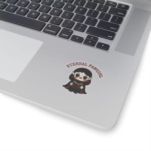 Sticker shaped like a black Puerto Rico license plate with the word "Bayamón", Isla del Encanto phrase, and Puerto Rican flags on both sides. 2in sticker with transparent outline on a laptop for reference.
