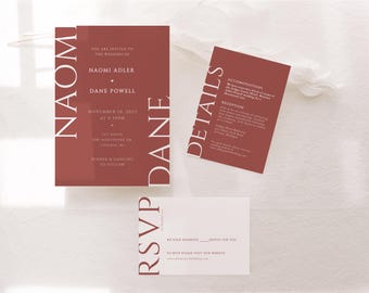 May include: A red wedding invitation suite with white text. The main invitation card features the names "Naomi Adler" and "Dane Powell" with the wedding date and time. The details card includes information about the reception and accommodations. The RSVP card has a place to indicate the number of guests attending.