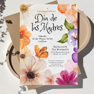 May include: A floral invitation for a Mother's Day celebration at The Briarpatch restaurant. The invitation features watercolor flowers in shades of pink, purple, orange, and yellow. The text reads "D&iacute;a de las Madres" and includes the date, time, and location of the event.