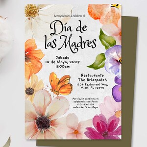 May include: A watercolor invitation with floral designs in shades of pink, purple, orange, and yellow. The invitation is for a Mother's Day celebration on Saturday, May 10, 2025 at 11:00 am at The Briarpatch restaurant. The text reads "D&iacute;a de las Madres" and includes the restaurant's address and a request to RSVP by May 3rd.