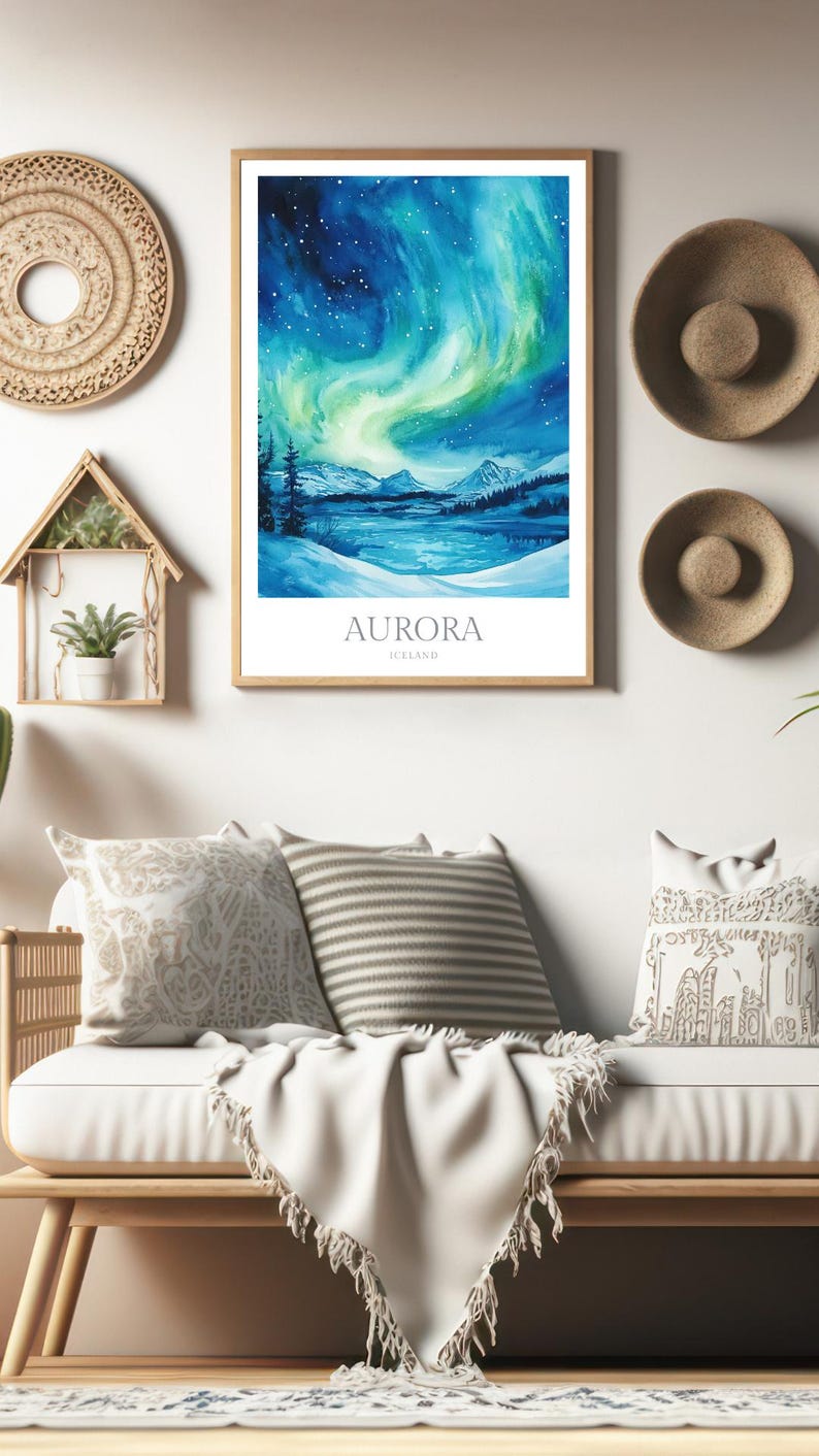 May include: A watercolor painting of the aurora borealis over a snowy landscape. The painting is framed in a light wood frame and has the text "AURORA ICELAND" at the bottom.