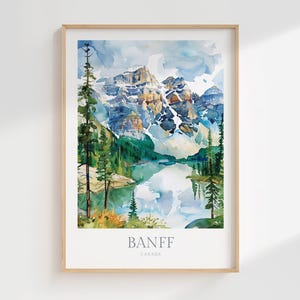 May include: Watercolor painting of a mountain range with a lake in the foreground. The mountains are a mix of blue, green, and brown, and the lake is a light blue. The text "BANFF CANADA" is at the bottom of the painting.