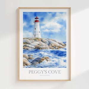 Può includere: Stampa ad acquerello del faro di Peggy's Cove in Nuova Scozia. Il faro bianco con la parte superiore rossa si erge su una costa rocciosa, con onde blu che si infrangono sulle rocce sotto un cielo blu. La stampa è in una cornice di legno.