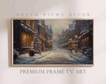 May include: Framed artwork depicting a snowy European street scene at dusk. The painting features buildings with lit windows, Christmas decorations, and a snow-covered road. Text at the top reads "DREAM VIEWS DECOR" and at the bottom "PREMIUM FRAME TV ART".