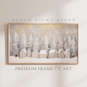 May include: A framed painting depicting a winter scene with a row of white houses with glowing windows set in a snowy forest. The sky is light blue with gold glitter.