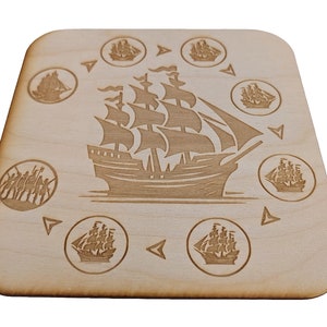 May include: A wooden coaster with a laser-engraved design of a sailing ship surrounded by smaller ships in a circular pattern.