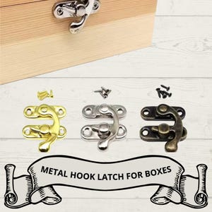 May include: Metal hook latches for boxes in gold, silver, and bronze finishes. The image shows a wooden box with a silver latch attached, and several latches with screws. The text reads "METAL HOOK LATCH FOR BOXES."