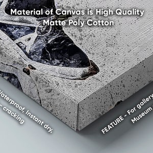 May include: Close-up of a canvas print with the text "Material of Canvas is High Quality Matte Poly Cotton". The canvas is textured and has a white background. The text "FEATURE - Waterproof, Instant dry, Anti - cracking" is visible on the left side of the image. The text "FEATURE - For gallery, Exhibition, Museum etc." is visible on the right side of the image.