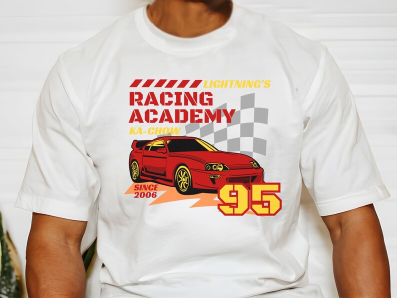May include: White t-shirt with a red and yellow graphic of a red sports car with the text "Lightning's Racing Academy Ka-Chow Since 2006 95"