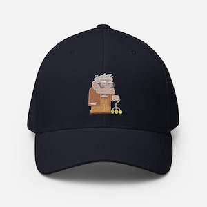 May include: A navy blue baseball cap featuring an embroidered cartoon image of an elderly man with glasses and a cane. The man is wearing an orange jacket and has white hair. The cap is a classic six-panel design.