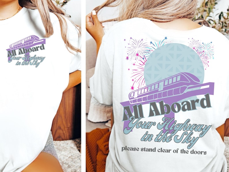 May include: White t-shirt with a purple and gray graphic of a monorail with the text "All Aboard Your Highway in the Sky" and "please stand clear of the doors".