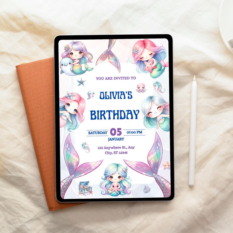 May include: A digital tablet displays a mermaid-themed birthday invitation. The invitation features illustrations of mermaids, starfish, and a treasure chest. The text reads "Olivia's Birthday" with the date and time. An orange notebook and a white stylus are next to the tablet.
