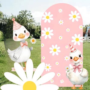 May include: A charming illustration of two cartoon geese, each wearing a party hat and holding a daisy. A pink archway decorated with white daisies is in the background. The geese have pink bows, set against a green grassy backdrop.