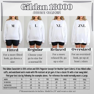 May include: Size chart for Gildan 18000 crewneck sweatshirts in sizes S to 5XL. The chart shows width, length, and sleeve length measurements in inches. The chart also includes descriptions of the fit for each size: fitted, regular, relaxed, and oversized.