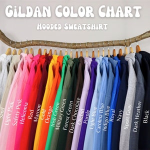 May include: Color chart of Gildan hooded sweatshirts, showing 20 different colors, including white, ash, sand, light pink, safety pink, heliconia, red, maroon, gold, orange, Irish green, military green, forest green, dark chocolate, orchid, purple, light blue, Carolina blue, indigo blue, royal, navy, sport gray, dark heather, and black.
