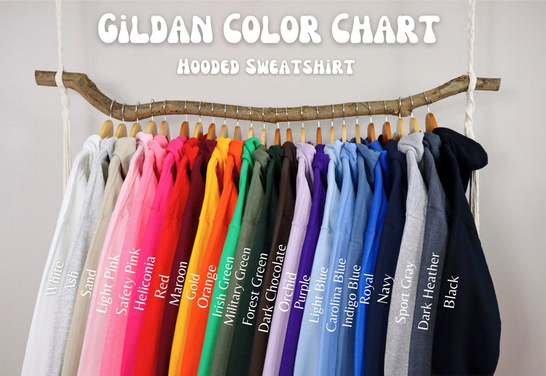 May include: Color chart of Gildan hooded sweatshirts, showing 20 different colors, including white, ash, sand, light pink, safety pink, heliconia, red, maroon, gold, orange, Irish green, military green, forest green, dark chocolate, orchid, purple, light blue, Carolina blue, indigo blue, royal, navy, sport gray, dark heather, and black.