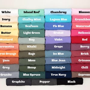 May include: A color chart of 36 different fabric swatches, each with a label indicating its color name. The colors range from white to black, with shades of blue, green, red, orange, yellow, and brown.