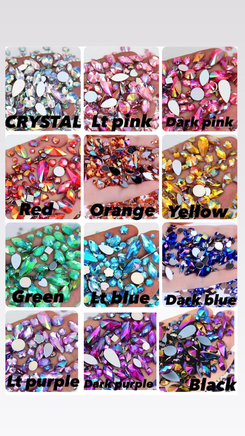 May include: A collection of twelve square panels displaying assorted faceted rhinestones in various colours including crystal, light pink, dark pink, red, orange, yellow, green, light blue, dark blue, light purple, dark purple, and black.