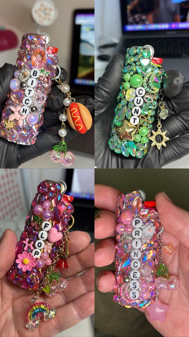 May include: Four lighters decorated with colourful rhinestones, beads, and charms. The lighters feature letter beads spelling BITCH, CUNT, FLOOP, and PRINCESS. Each lighter includes dangling charms like a hot dog, sun, rainbow, and cherries.