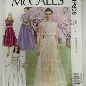 May include: A McCall's MP306 sewing pattern envelope featuring David Tutera designs. The cover displays illustrations of two-piece outfits with lace crop tops and long skirts in various colors, including white, purple, and magenta, with size E5.