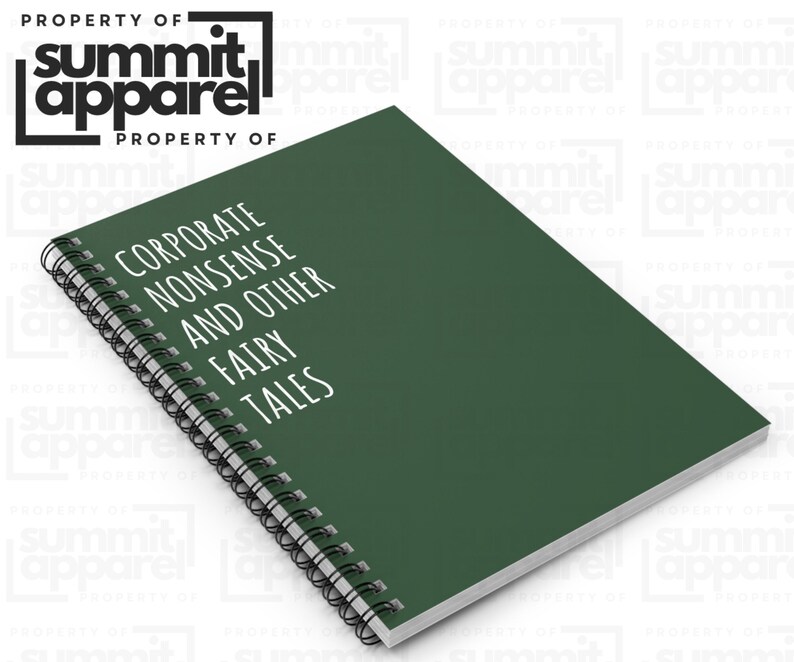 May include: A dark green spiral-bound notebook with the text "CORPORATE NONSENSE AND OTHER FAIRY TALES" in white. The notebook is from Summit Apparel. The cover is a solid, deep green colour.