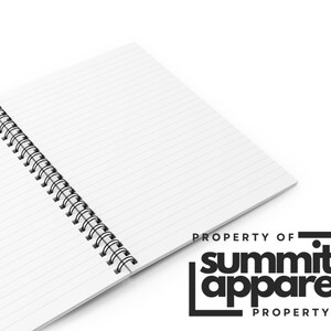 May include: A white, lined notebook with a black spiral binding. The pages are ruled with horizontal lines. The notebook features the text "PROPERTY OF" above and below the black and white "Summit Apparel" logo.