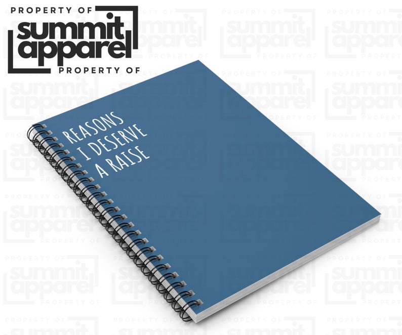 May include: A blue spiral-bound notebook featuring the text "REASONS I DESERVE A RAISE" in white. The notebook is from Summit Apparel.