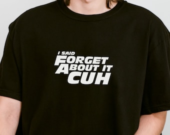 May include: Black t-shirt with white text that reads "I said FORGET ABOUT IT CUH".