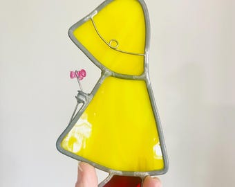 Vintage Stained Glass Girl with Flower – Yellow Raincoat Suncatcher