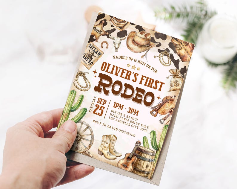 May include: A rustic-themed invitation for a child's first rodeo. The invitation features a brown and white cowhide pattern, a cowboy hat, a lasso, a cactus, and a guitar. The text on the invitation reads "Oliver's First Rodeo" and includes the date, time, and location of the event.