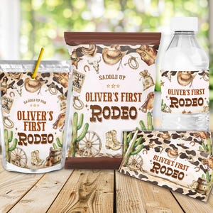 May include: A collection of party supplies with a cowboy theme, including a drink pouch with a straw, a snack bag, a water bottle, and a candy bar. Each item features the text "Oliver's First Rodeo" and cowboy-themed illustrations.