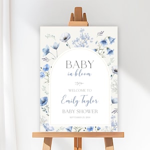 Blue Baby in Bloom Baby Shower Welcome Sign – a charming floral welcome for your sweet boy’s special day! This pastel blue Baby in Bloom Welcome Sign features delicate wildflowers, spring blooms, and garden-inspired elements, perfect for setting the tone at your boy baby shower. Ideal for decorating entryways, dessert tables, or photo backdrops, this wildflower floral welcome sign adds a soft, boho touch to your celebration.