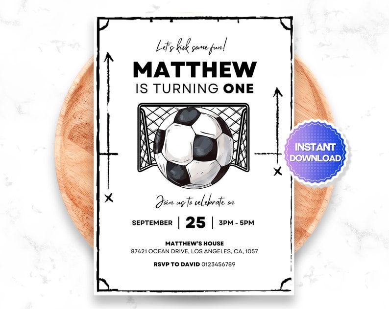Op de afbeelding: Een witte printbare uitnodiging met zwarte tekst en een zwart-witte illustratie van een voetbal die in een doel gaat. De tekst luidt "Let's kick some fun! Matthew is turning one. Join us to celebrate on September 25, 3PM-5PM. Matthew's House, 87421 Ocean Drive, Los Angeles, CA, 1057. RSVP to David 0123456789."