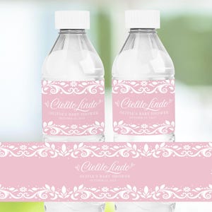 Cielito Lindo Baby Shower Water Bottle Label in pastel pink featuring papel picado and Pink Talavera patterns. A festive Mexican-themed party favor for girl baby showers. Editable in Canva, perfect for adding charm to your Cielito Lindo celebration.