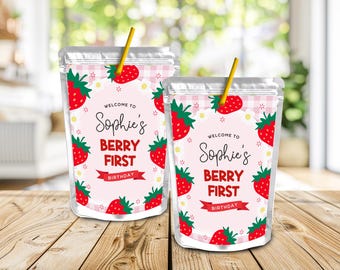 May include: Two pink and white juice pouch labels with a strawberry theme. The labels feature the text "Welcome to Sophie's Berry First Birthday".