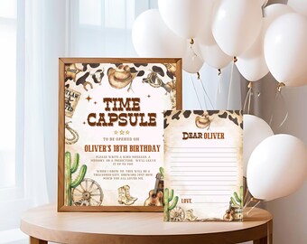 May include: A printable time capsule sign with a cowboy theme. The sign has a brown wooden frame and features a brown, white, and black cowhide pattern. The text on the sign reads "Time Capsule" and "To be opened on Oliver's 18th Birthday". There is also a separate printable card with the text "Dear Oliver" and a space for writing a message.