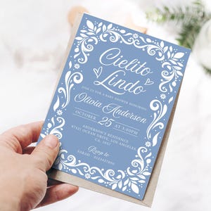 Cielito Lindo Baby Shower Invitation featuring papel picado designs and a Mexican theme. Perfect for a boy baby shower with Blue Talavera patterns and pastel blue accents. A festive and cultural invite for a beautiful and memorable celebration.