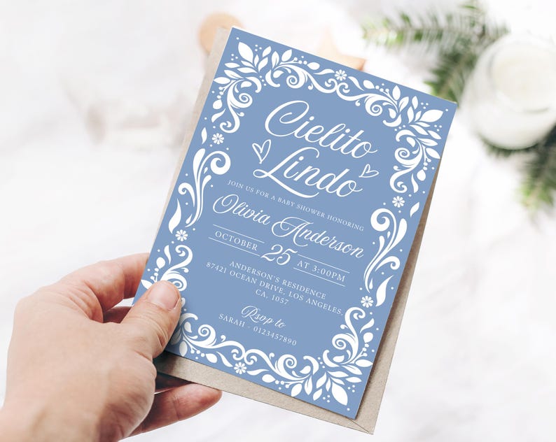 Cielito Lindo Baby Shower Invitation featuring papel picado designs and a Mexican theme. Perfect for a boy baby shower with Blue Talavera patterns and pastel blue accents. A festive and cultural invite for a beautiful and memorable celebration.