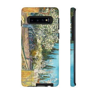 May include: A phone case featuring a landscape painting with a path, trees, and a blue sky. The artwork has a textured, impressionistic style with visible brushstrokes. The case is black with a camera cutout.