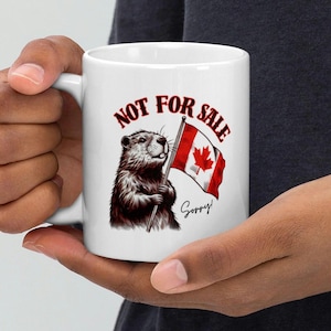 May include: White ceramic mug featuring a cartoon groundhog holding a Canadian flag. The text "NOT FOR SALE" is printed in red above the groundhog and the text "Sorry!" is printed in black below the groundhog.