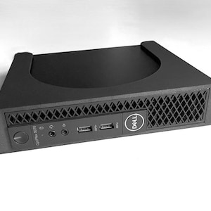 May include: Black computer server with the Dell logo. The server has a front panel with USB ports and audio jacks. The OptiPlex 3070 model is visible. The server is mounted in a rack.