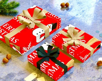 May include: Three wrapped Christmas gifts with red paper featuring a snowman design and the words "Merry Christmas". Each gift is tied with a ribbon and bow. One gift has a dark green bow, while the others have tan bows.