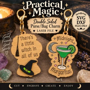 May include: Two wooden purse charms with gold-tone lobster clasps. The left charm features a broomstick, a black witch hat, and the text There's a little witch in all of us. The right charm shows a margarita, a crescent moon, and Midnight Margaritas.