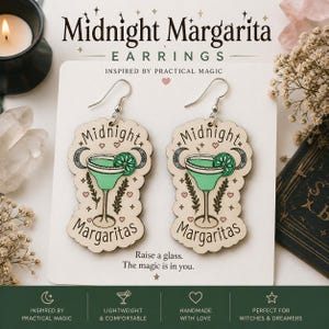 May include: Wooden Midnight Margarita earrings with a margarita glass design in teal and cream. The earrings have silver hooks and feature the words "Midnight Margaritas". The earrings are lightweight and comfortable.