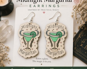 May include: Wooden Midnight Margarita earrings with a margarita glass design in teal and cream. The earrings have silver hooks and feature the words "Midnight Margaritas". The earrings are lightweight and comfortable.