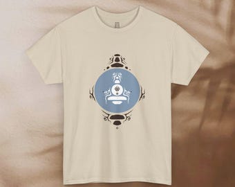 May include: A cream colored t-shirt with a blue and brown geometric design on the front. The design features a stylized image of a person sitting in a meditative pose.