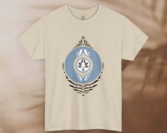 May include: A beige t-shirt with a blue and brown geometric design. The design features a circle with a stylized flower inside.